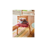 Kip & Co Iced Vovo stripe frill upholstery cushion with colorful striped fabric and ruffled edges on a soft cushion.