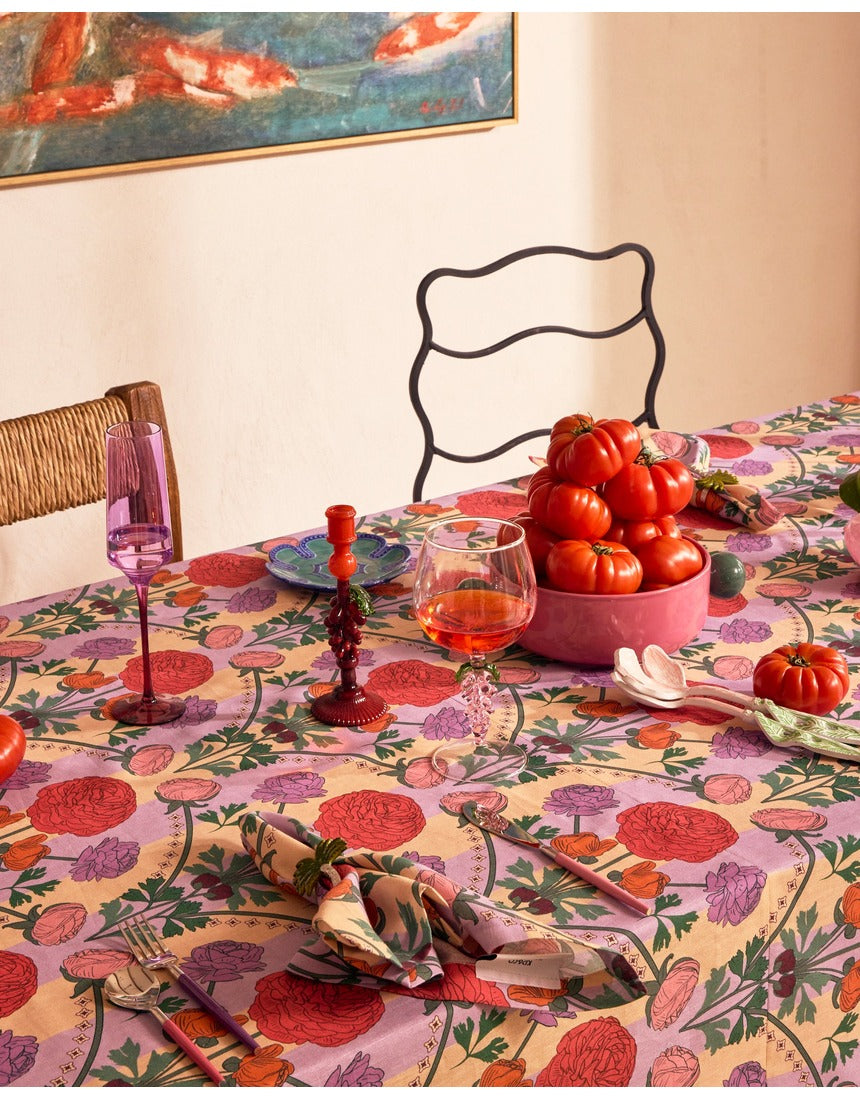 Kip&Co floral salad servers with colorful patterned handles and stainless steel tongs for serving salads.
