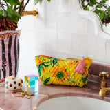 Kip & Co Passiona velvet toiletry bag in vibrant pink with elegant design, perfect for storing personal accessories.