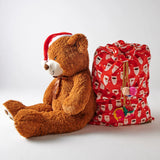 Kip & Co red velvet Santa sack with "HoHoHo" lettering, Christmas holiday gift bag, soft fabric and festive design.