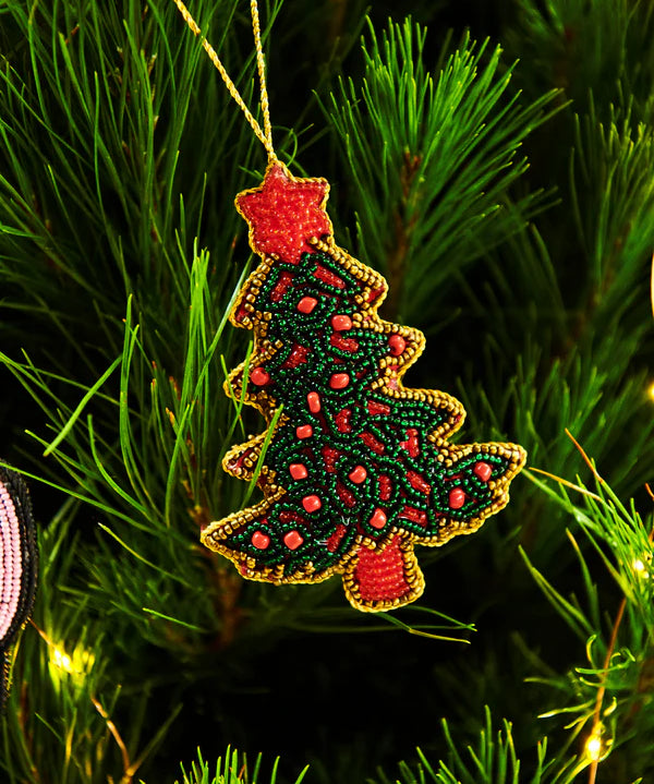 Kip & Co Christmas Tree decoration featuring a festive, colorful ornament with holiday patterns and a hanging string.