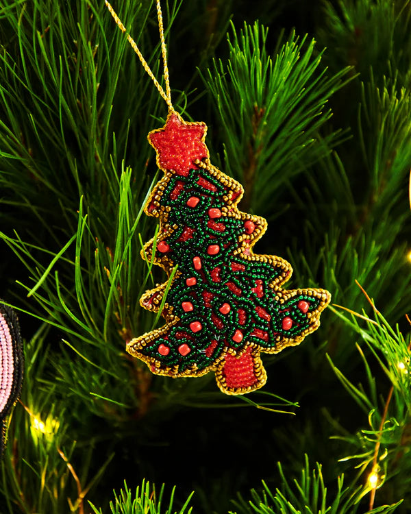 Kip & Co Christmas Tree decoration featuring a festive, colorful ornament with holiday patterns and a hanging string.