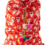 Kip & Co HoHoHo red velvet Santa Sack with white festive lettering and plush drawstring closure for holiday gift giving.