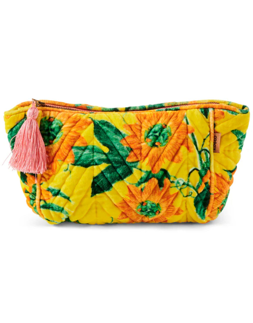 Kip & Co Passiona Velvet Toiletry Bag in vibrant floral print, soft velvet material, with zipper closure and compact accessory design.
