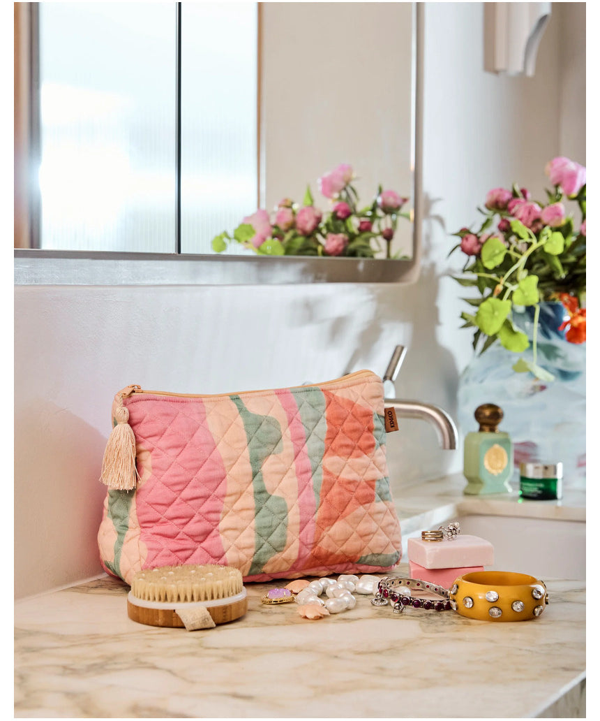 Kip & Co Sun Soaked quilted cotton toiletry purse with colorful floral pattern and zipper closure.