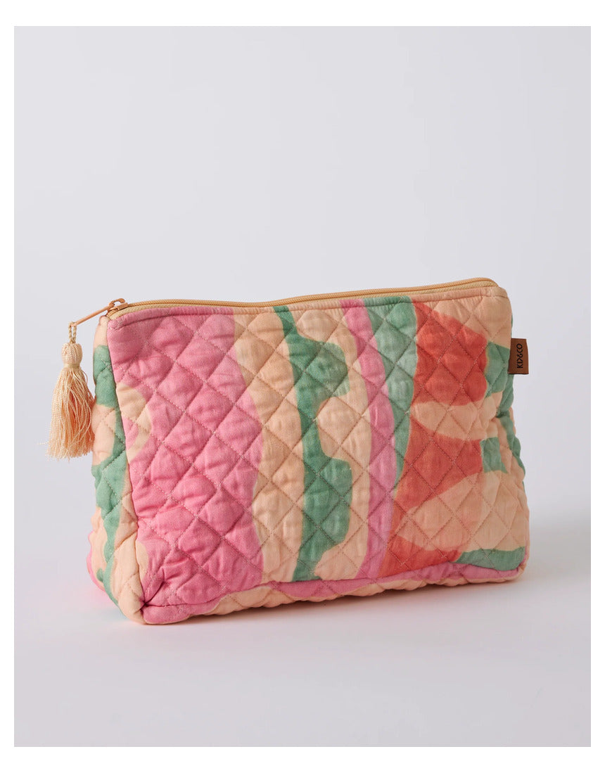 Kip & Co Sun Soaked quilted cotton toiletry purse with colorful pattern, compact bag for toiletries and travel essentials.