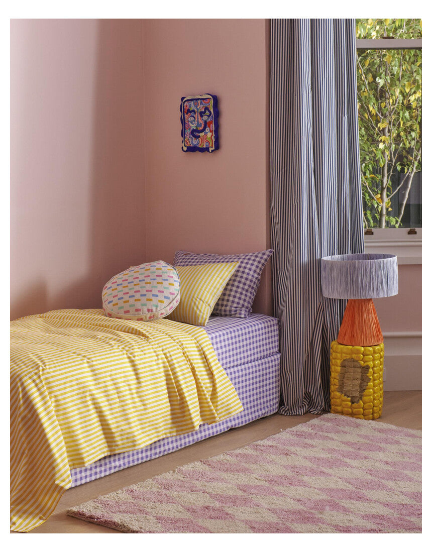 Kip & Co Tangier Raffia Table Lamp with woven rattan base and neutral fabric shade, stylish home lighting decor.
