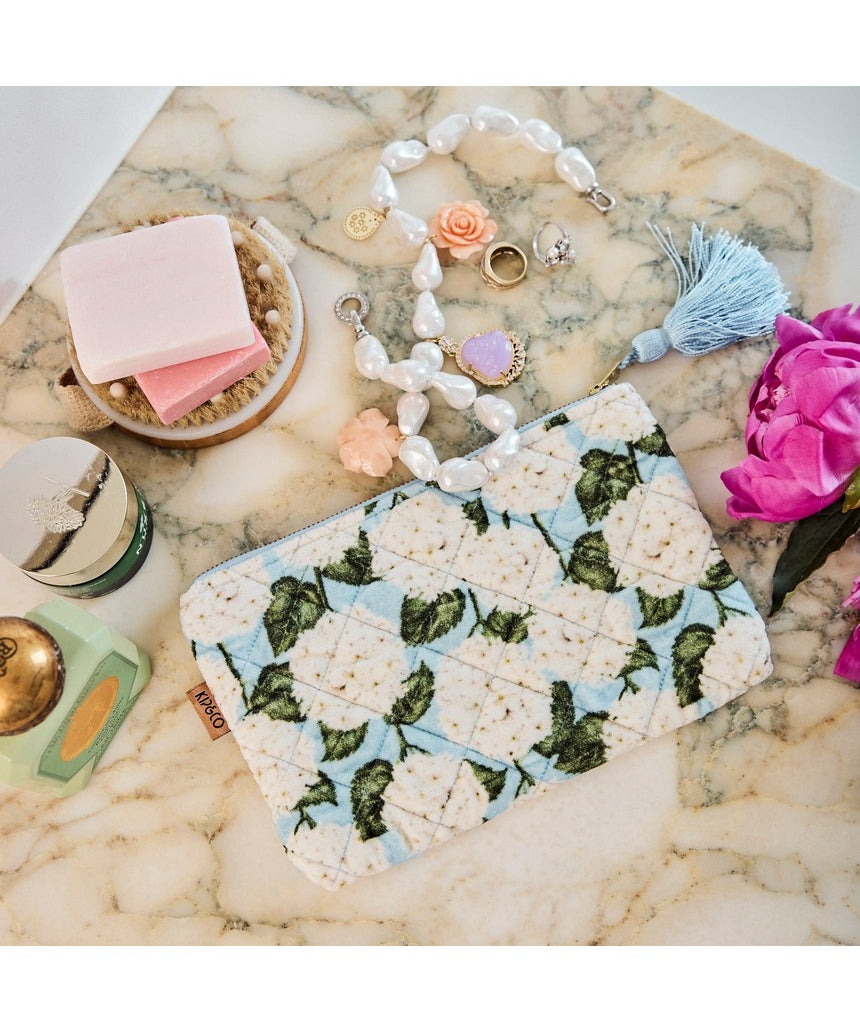 Kip&Co velvet cosmetics purse in Hydrangea Blue with a soft textured fabric and compact design for beauty essentials.