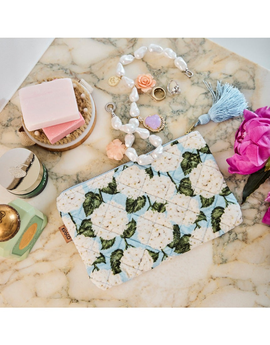 Kip&Co velvet cosmetics purse in Hydrangea Blue with a soft textured fabric and compact design for beauty essentials.