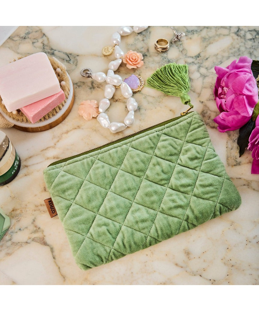Kip&Co velvet cosmetics purse in Pesto color, featuring soft fabric and compact design for storing makeup essentials.