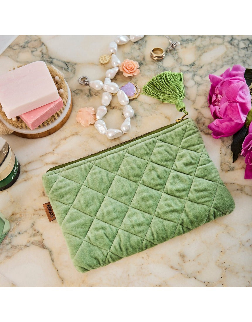 Kip&Co velvet cosmetics purse in Pesto color, featuring soft fabric and compact design for storing makeup essentials.