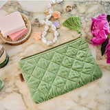 Kip&Co velvet cosmetics purse in Pesto color, featuring soft fabric and compact design for storing makeup essentials.