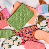 Kip&Co velvet cosmetics purse in Pesto color with a soft, textured fabric and compact design for storing makeup essentials.
