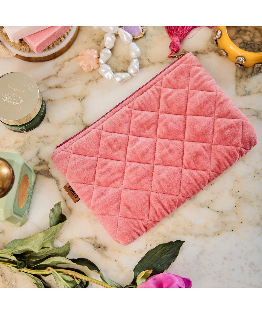 Kip&Co velvet cosmetics purse in strawberry color with a soft, plush texture and compact design for storing makeup essentials.