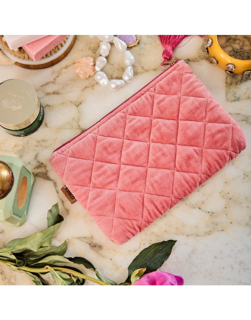 Kip&Co velvet cosmetics purse in strawberry color with a soft, plush texture and compact design for storing makeup essentials.