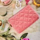 Kip&Co velvet cosmetics purse in strawberry color with a soft, plush texture and compact design for storing makeup essentials.