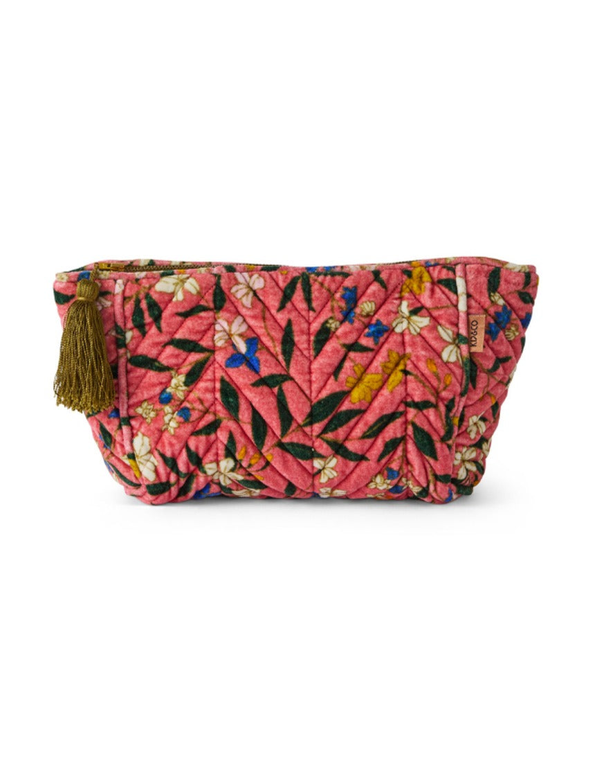 Kip&Co velvet toiletry bag in Canopy Rose with soft fabric and zipper closure, designed for travel storage of personal items.