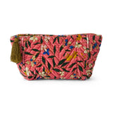 Kip&Co velvet toiletry bag in Canopy Rose with soft fabric and zipper closure, designed for travel storage of personal items.