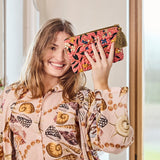 Kip&Co velvet toiletry bag in Canopy Rose with soft pink velvet fabric and zipper closure, designed for travel organization.