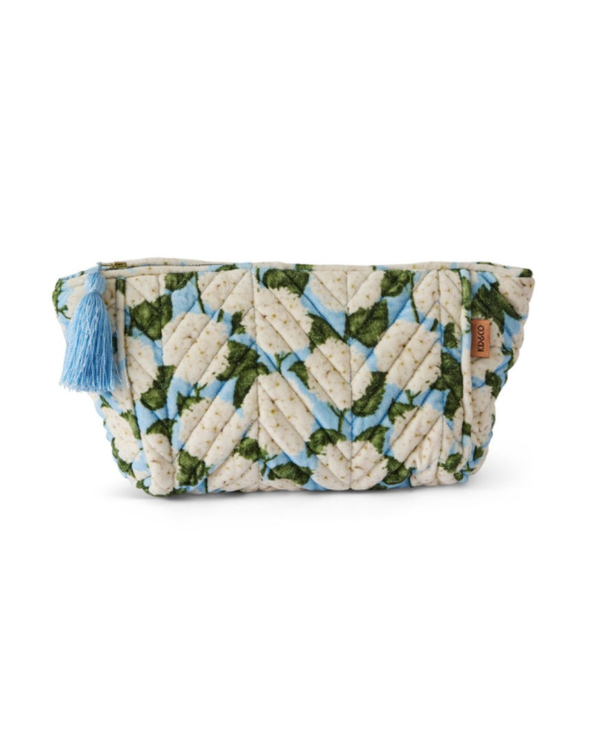 Kip&Co velvet toiletry bag in Hydrangea Blue with a soft, plush texture and floral pattern, ideal for travel organization.
