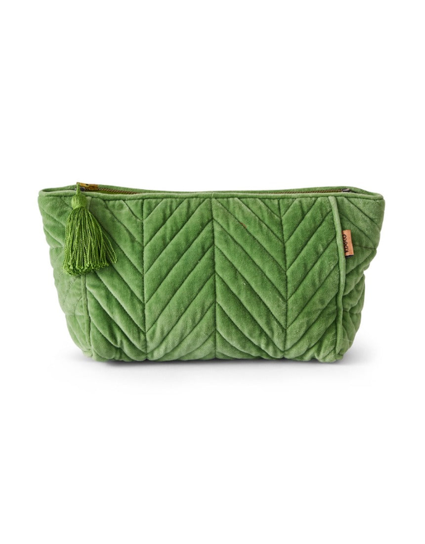 Kip&Co velvet toiletry bag in Pesto color with soft texture and zipper closure, designed for travel and storage.
