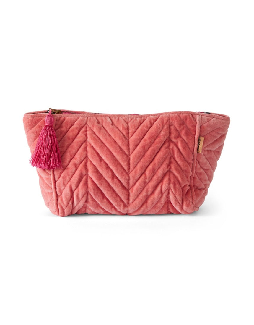Kip&Co velvet toiletry bag in strawberry color, soft fabric with zipper closure, designed for travel toiletries storage.