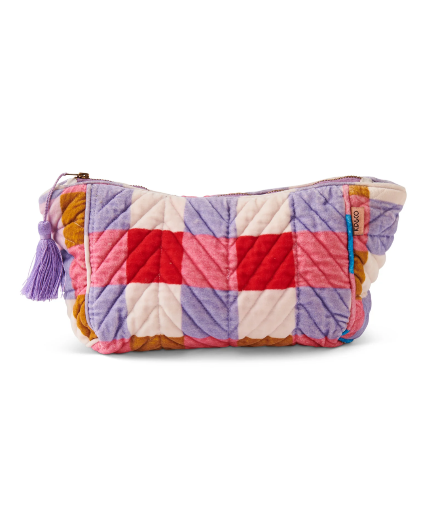 Kip & Co summer check velvet toiletry bag with a colorful check pattern and soft velvet material.