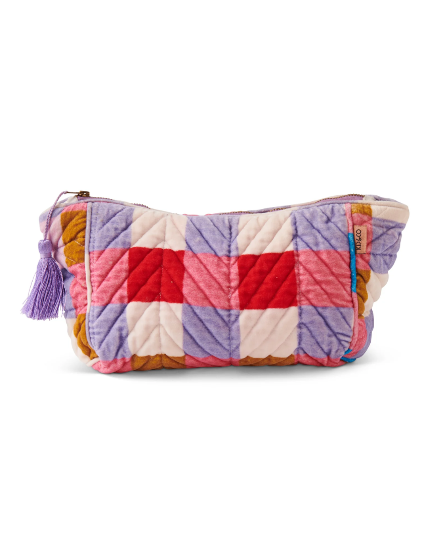 Kip & Co summer check velvet toiletry bag with a colorful check pattern and soft velvet material.