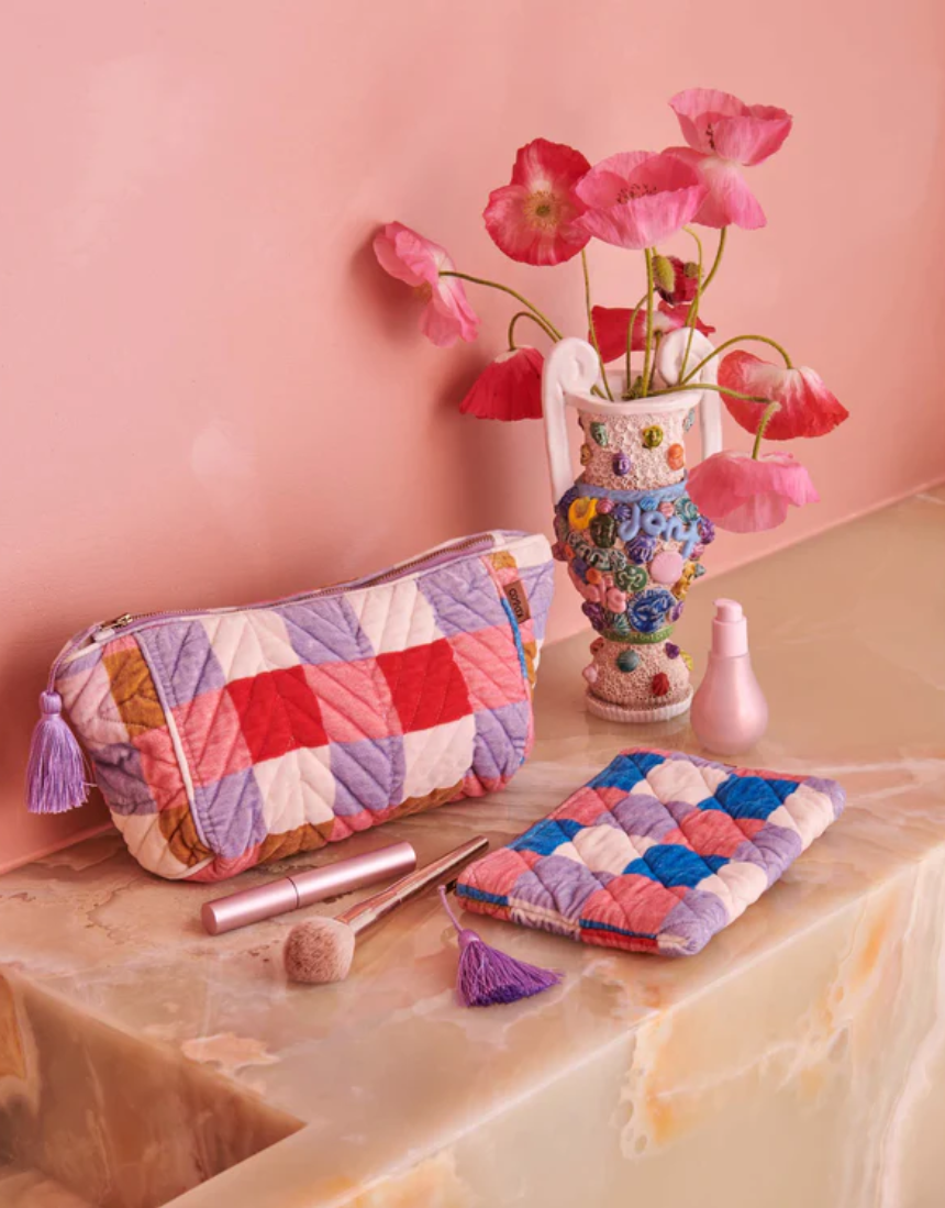 Kip & Co summer check velvet toiletry bag in vibrant check pattern, soft velvet fabric, perfect for travel accessories.