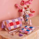 Kip & Co summer check velvet toiletry bag in vibrant check pattern, soft velvet fabric, perfect for travel accessories.
