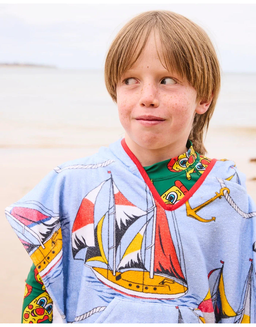 Kip&Co printed kids terry poncho with sailor-themed design, soft fabric, and hood, perfect for children’s outdoor comfort.