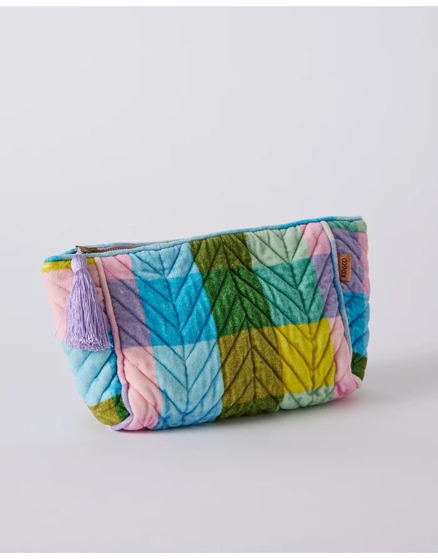 Kip&Co velvet toiletry bag in Sorbet Tartan with a soft, plush fabric and zip closure, designed for travel organization.