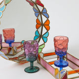 Kip & Co Bon Bon round serving tray with colorful abstract pattern and raised rim