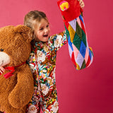 Kip & Co Jolly Christmas Harlequin velvet stocking with colourful harlequin pattern and hanging loop