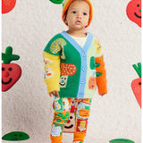 Knit baby booties with pocket patches by Halcyon Nights, paired with matching cardigan, leggings, and beanie for cozy baby clothing.