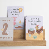 Living Textiles Baby Milestone Cards featuring a tractor ride design, colorful and perfect for capturing baby's special moments.