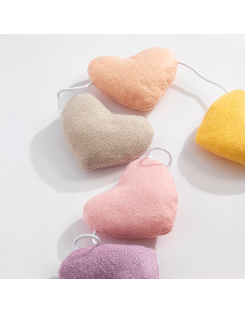 Living Textiles Felt Heart Bunting in Bohemian Bliss nursery decor, colorful felt hearts hanging as playful wall decoration