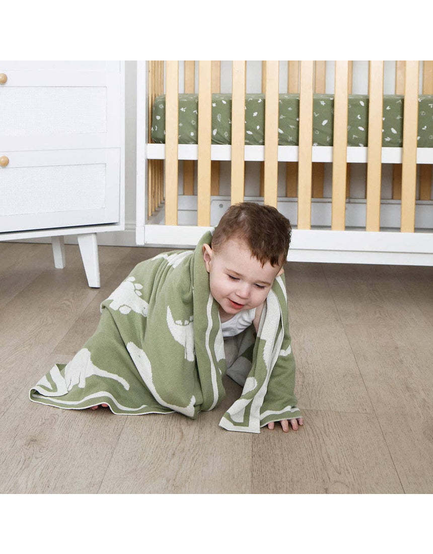 Living Textiles knitted pram blanket with dinosaur pattern, soft and cozy baby blanket for infants.