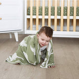 Living Textiles knitted pram blanket with dinosaur pattern, soft and cozy baby blanket for infants.