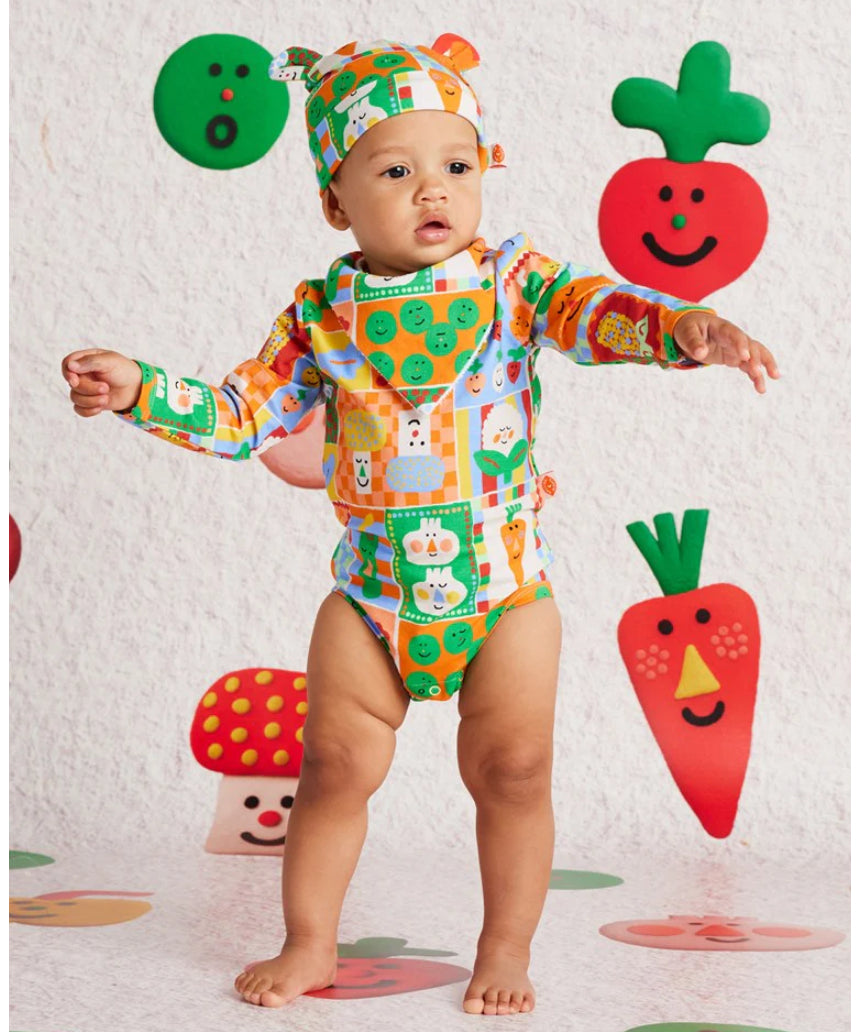 Baby bib with pocket patch by Halcyon Nights, featuring colorful design and soft fabric, perfect for feeding and keeping clothes clean.