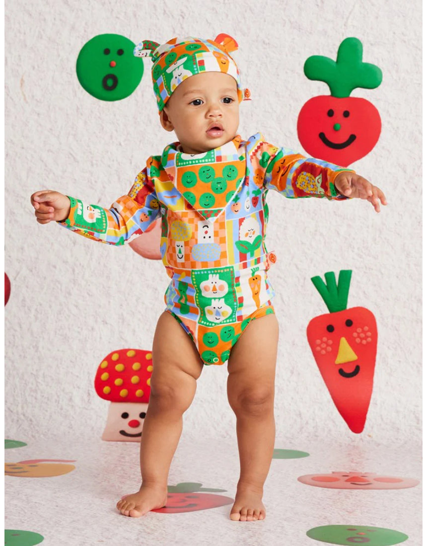 Baby bib with pocket patch by Halcyon Nights, featuring colorful design and soft fabric, perfect for feeding and keeping clothes clean.