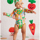 Baby bib with pocket patch by Halcyon Nights, featuring colorful design and soft fabric, perfect for feeding and keeping clothes clean.