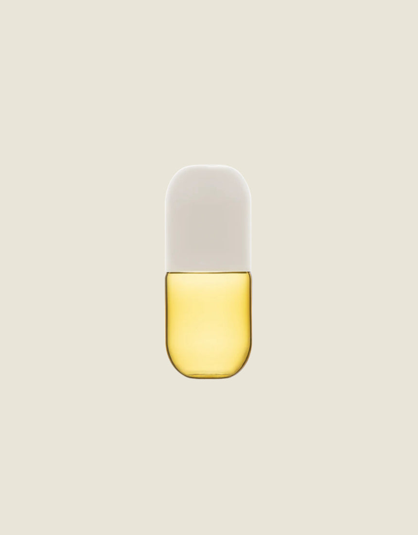 Maho Happi Pill fried egg-shaped glassware with a clear design, perfect for serving drinks or as a novelty drink accessory.