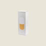 Maho Happi Pill box packaging featuring a fried egg illustration, showcasing the product's playful design and branding.