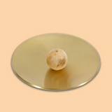 Yellow jade incense burner holder with intricate design, crafted by Maho, featuring the Hoseki Mari motif and smooth, polished surface.