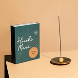 Maho Hoseki Mari yellow jade incense burner holder with intricate carved design, showcasing glossy yellow jade surface.