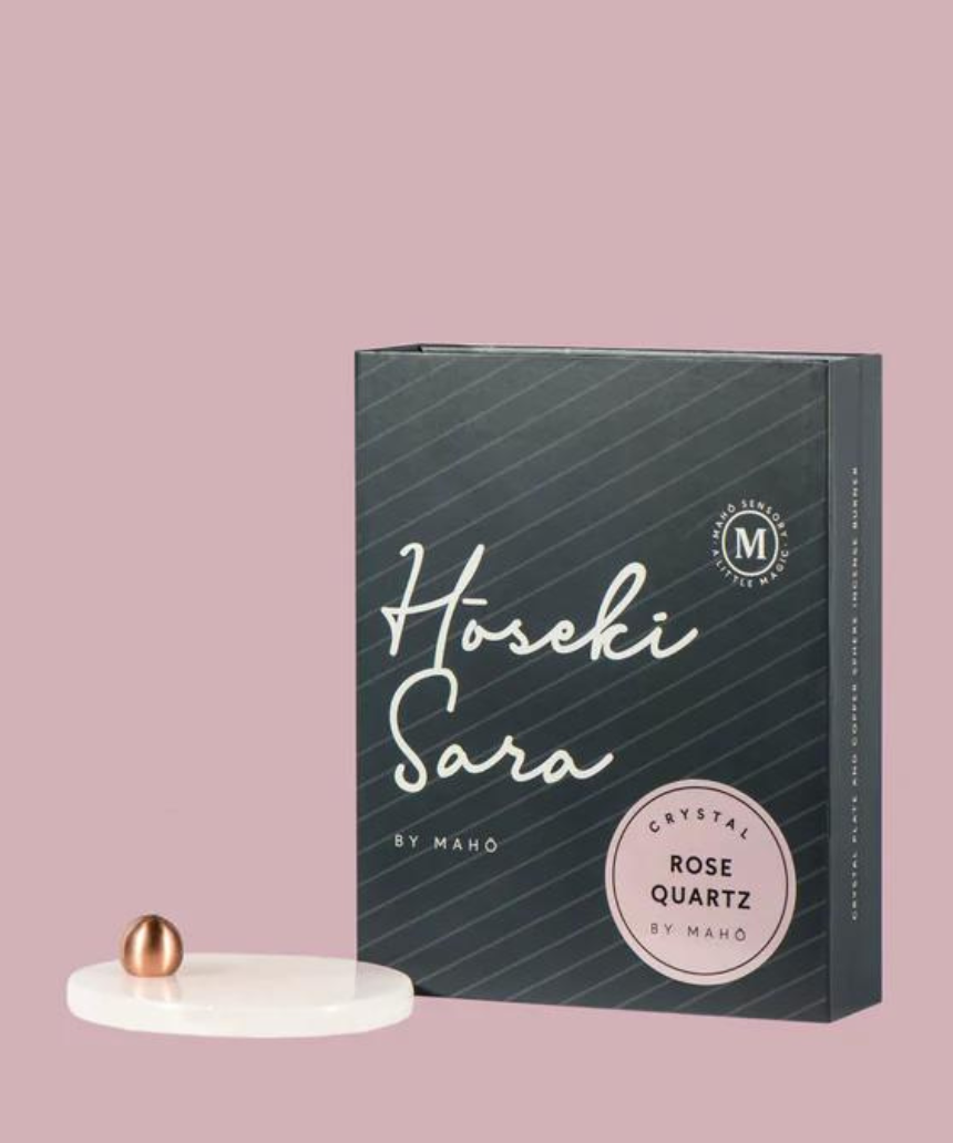 Maho Hoseki Sara rose quartz incense burner holder with smooth, polished stone and elegant design for holding incense sticks.