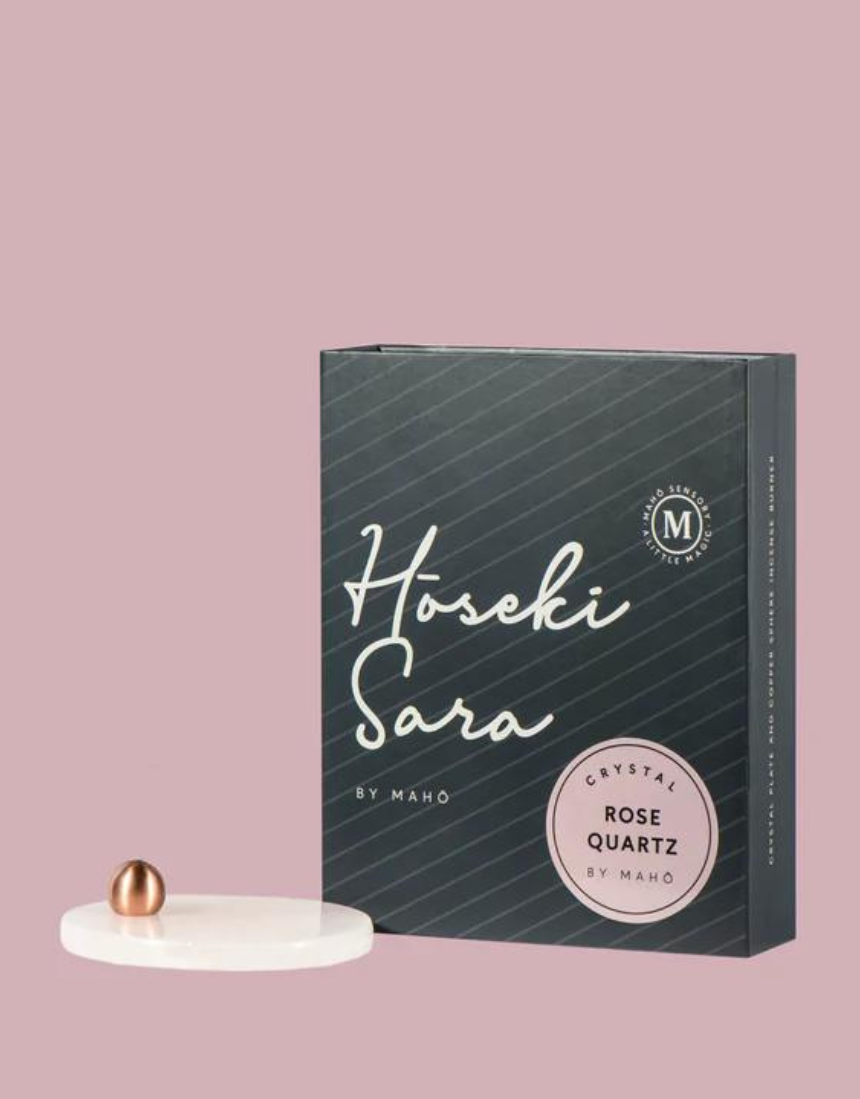 Maho Hoseki Sara rose quartz incense burner holder with smooth, polished stone and elegant design for holding incense sticks.