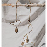 Matr Boomie Air Element Bird Bell Wind Chime displaying metal bird and bell design hanging outdoors