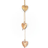 Matr Boomie Alaya Heart Trio Wind Chime with three heart-shaped metal tubes hanging from a decorative top.
